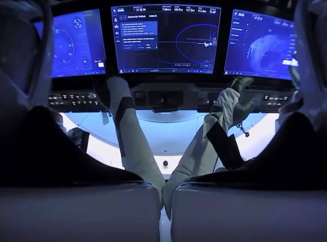 In this image from video made available by NASA, astronauts Doug Hurley, left, and Bob Behnken ...