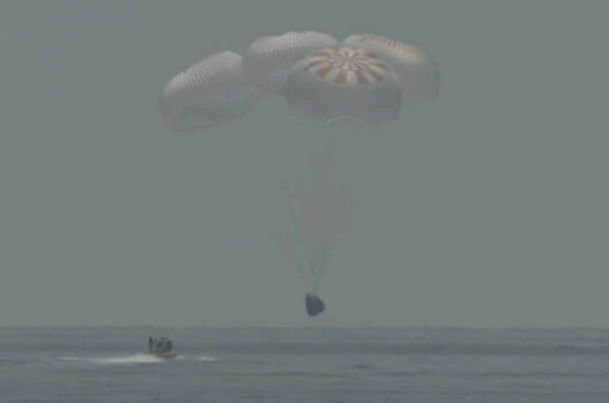 In this frame grab from NASA TV, the SpaceX capsule splashes down Sunday, Aug. 2, 2020 in the G ...