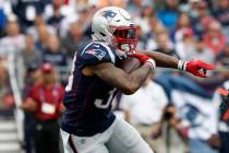 New England Patriots' Jeremy Hill runs against the Houston Texans during an NFL football game a ...