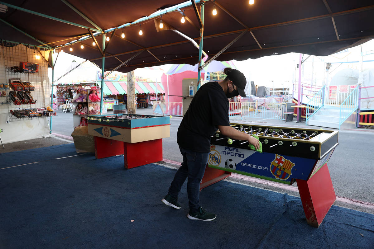 Shop owner Luis Arturo Cordoba Reyes cleans his foosball tables at Broadacres Marketplace in No ...