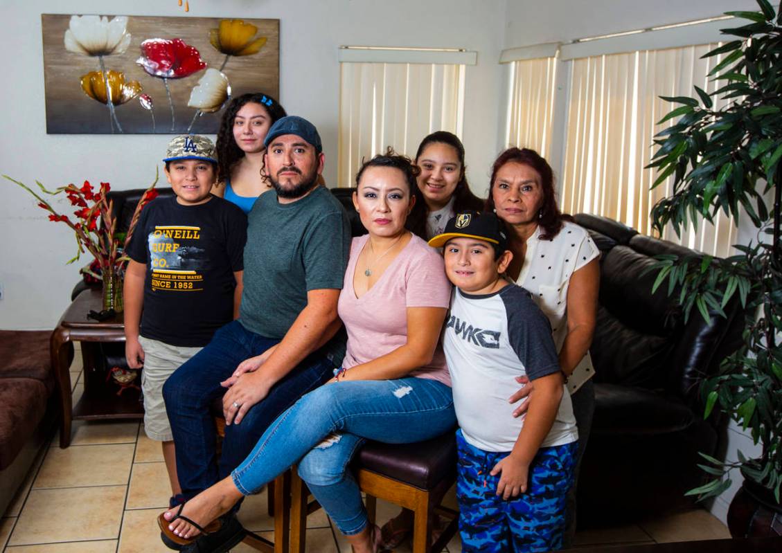 Angie Leyva, center, poses with her husband Andy Leyva, left, mother Guadalupe Rojas and childr ...