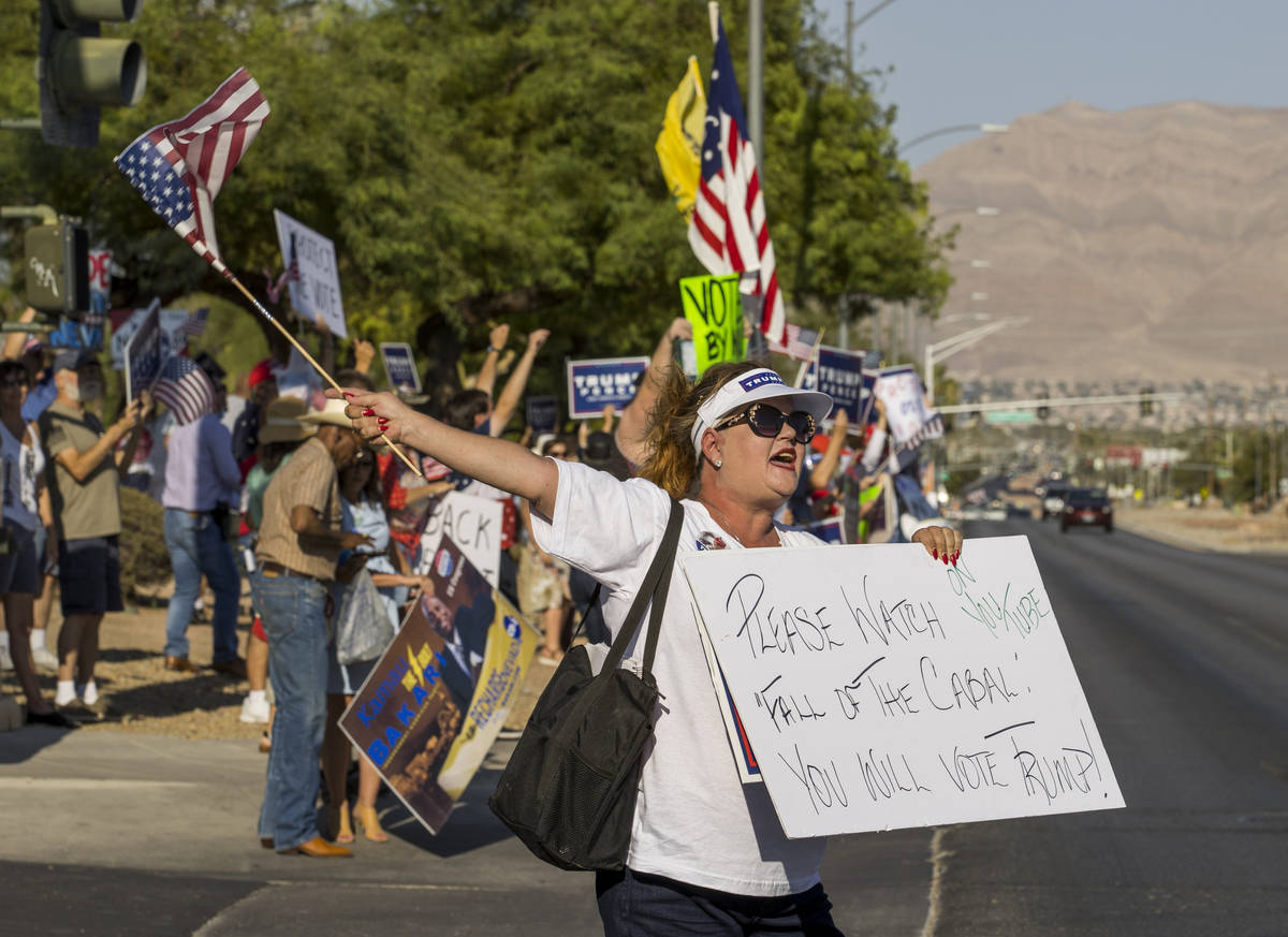Protestor Delta Remington yells out in front of the Grant Sawyer building to voice opposition a ...