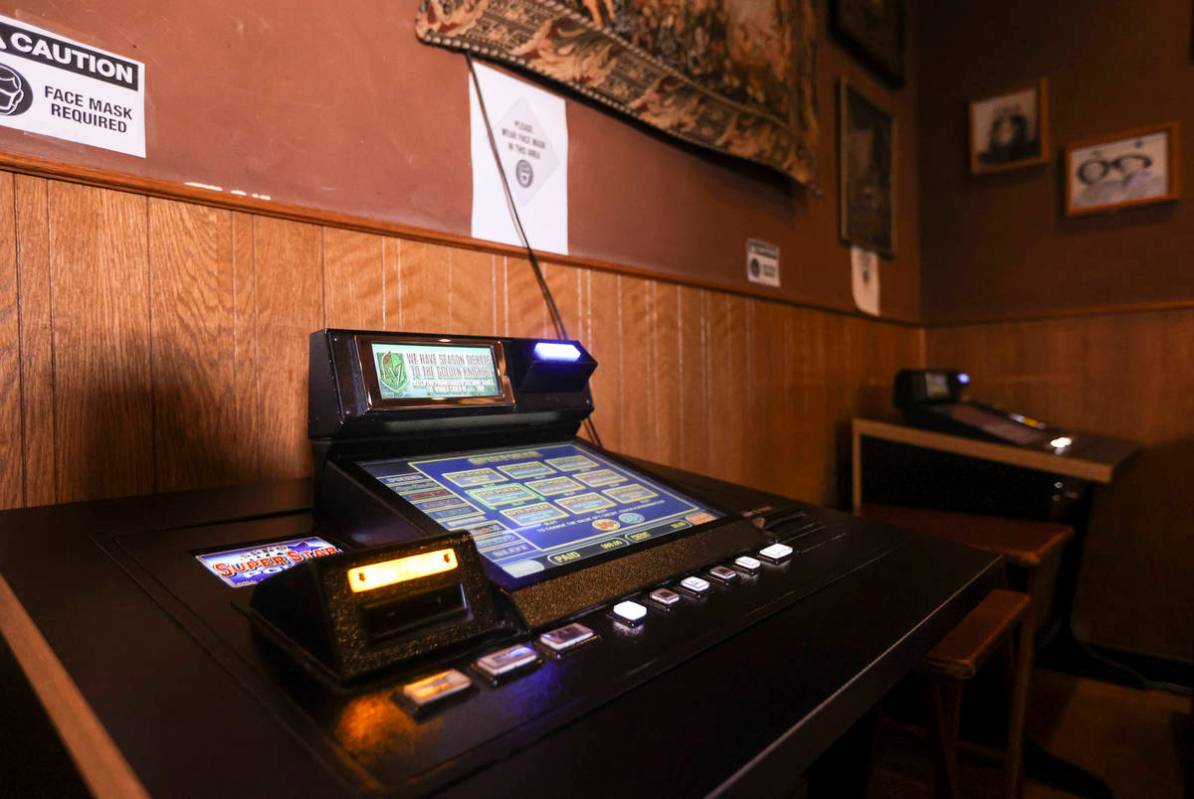 A gaming machine that was formerly at the bar is seen in a lounge area at Black Mountain Grill ...
