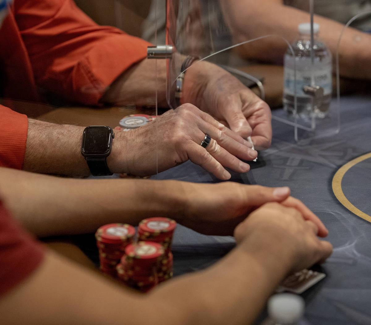 An eight-handed game is played using plexiglass dividers between the players in the Red Rock Re ...