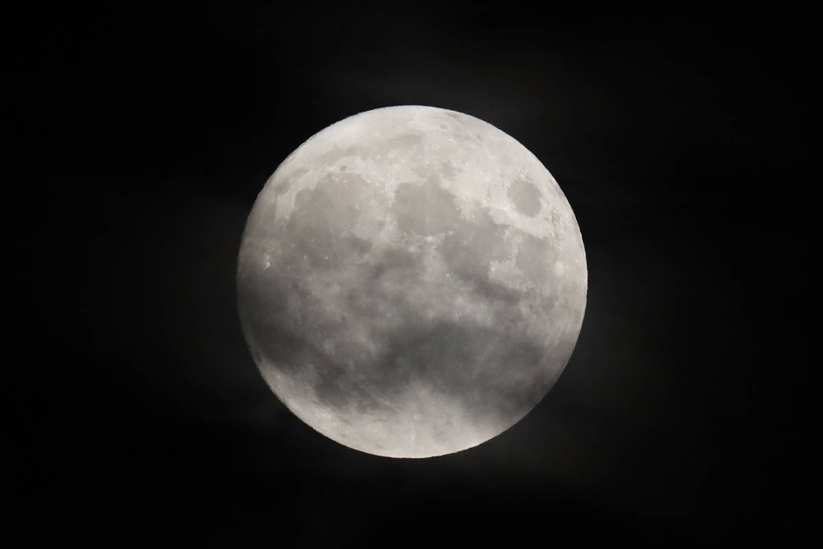 The moon shines brightly as it rises during a baseball game between the New York Yankees and th ...