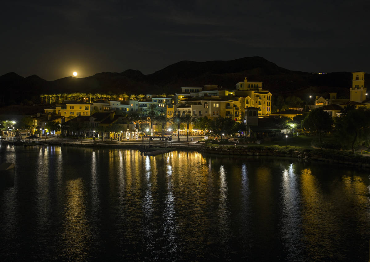 The Sturgeon moon rises above the shops at Lake Las Vegas on Monday, August 3, 2020, in Henders ...