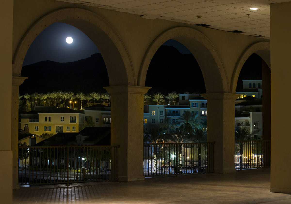 The Sturgeon moon rises above the shops at Lake Las Vegas on Monday, August 3, 2020, in Henders ...