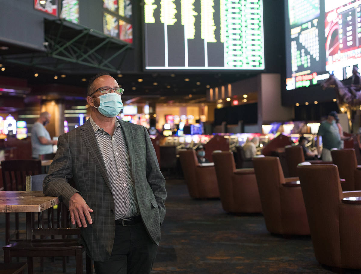 Jay Korneygay, director of the Westgate sportsbook, spends time among guests at the Westgate sp ...