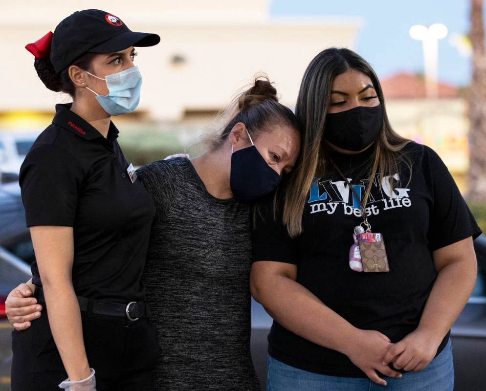 Iliana Dacosta, left, Karen Rene and Fernanda Barraza comfort each other during a vigil for Nel ...