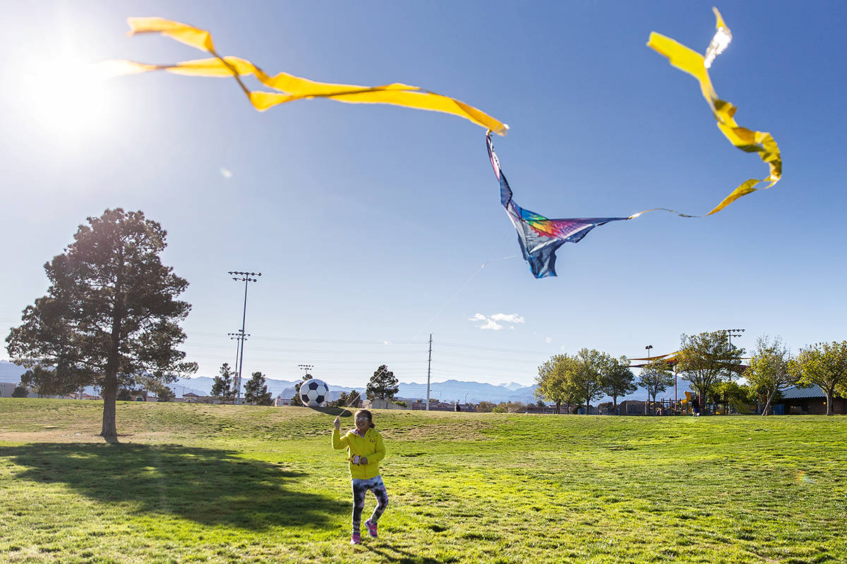 Las Vegas residents take advantage of the open space at Desert Breeze Park  flying kites on Frid …