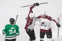 Dallas Stars' Roope Hintz (24) skates past as Colorado Avalanche's Valeri Nichushkin (13) and A ...