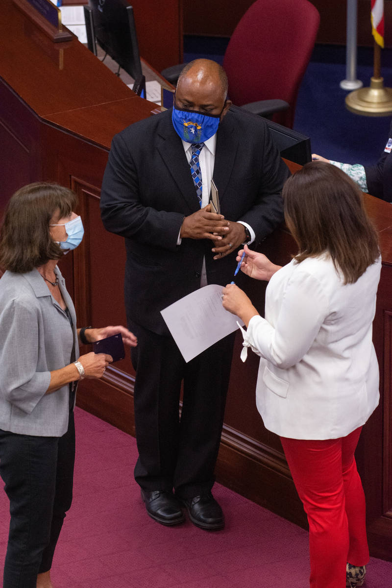 Assembly Speaker Jason Frierson speaks with Assembly Minority Co-Leader Robin Titus, left, and ...