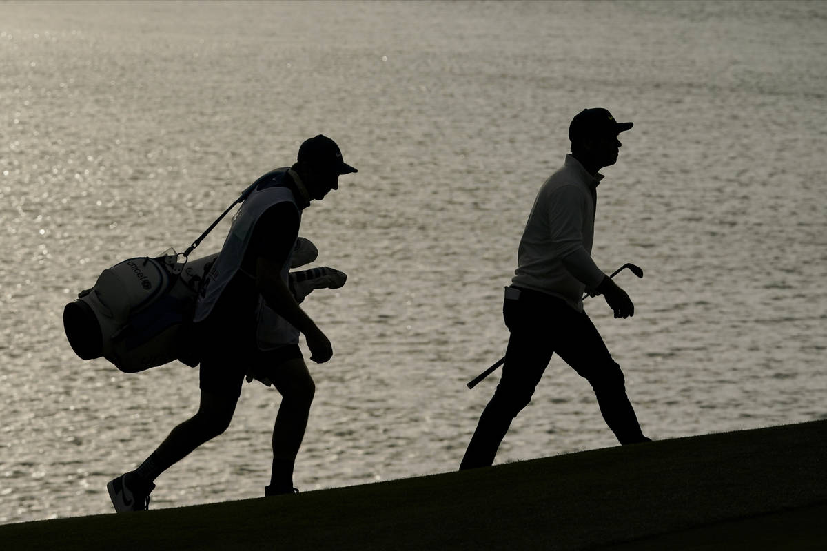 Paul Casey and his caddie walks to the 18th green during the first round of the PGA Championshi ...