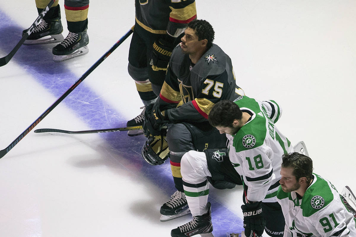 The Golden Knights' Ryan Reaves (75) is shown kneeling during the national anthems before an NH ...