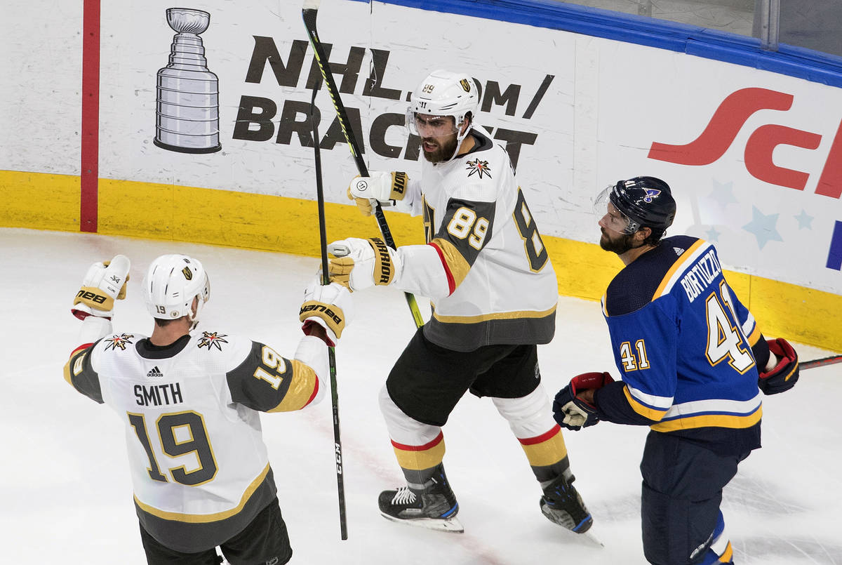 St. Louis Blues' Robert Bortuzzo (41) looks on as Vegas Golden Knights' Reilly Smith (19) and t ...
