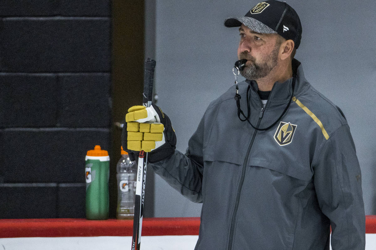 Vegas Golden Knights head coach Peter DeBoer blows his whistle for players during practice at t ...