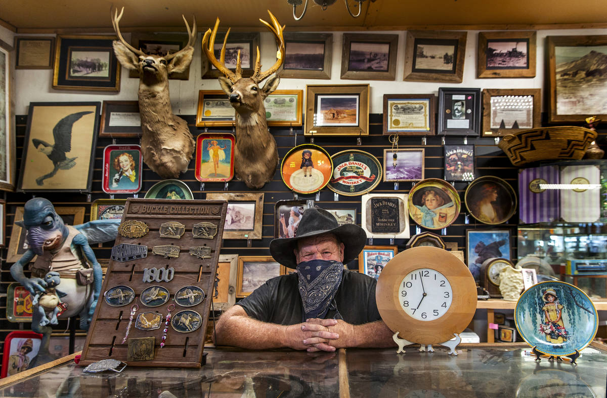 Owner Bryan Smalley behind a counter of the Hidden Treasure Trading Co. just into Goldfield alo ...