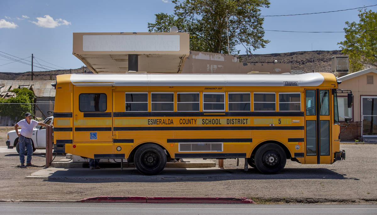 An Esmeralda County School District bus is refueled in Goldfield along I-95 on Tuesday, August ...