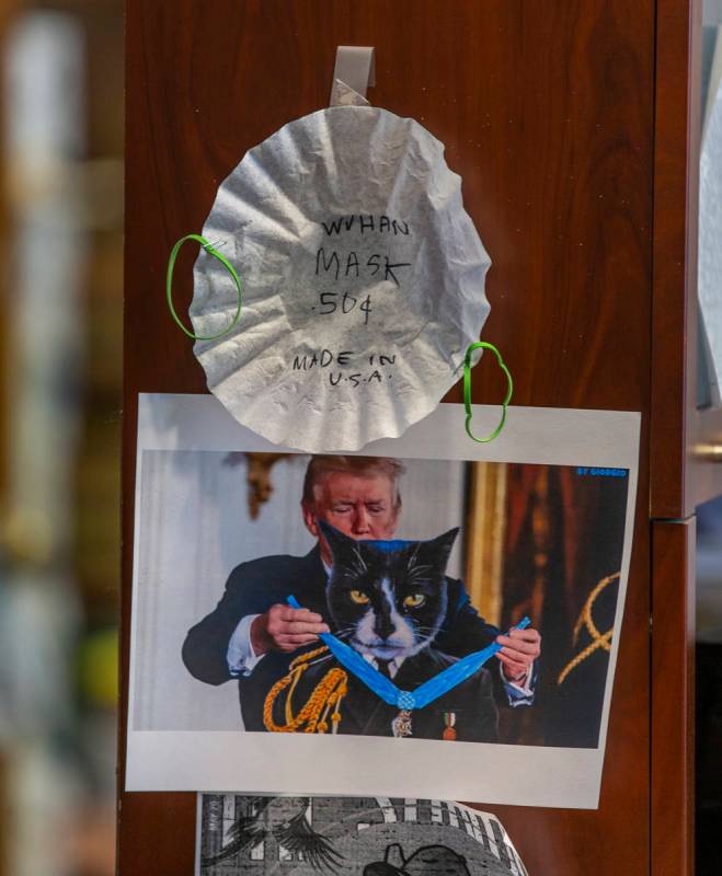A handmade face covering some humor mark hang in an office within the Esmeralda County Courthou ...