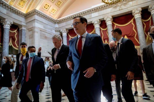 White House Chief of Staff Mark Meadows, center left, and Treasury Secretary Steven Mnuchin, ce ...