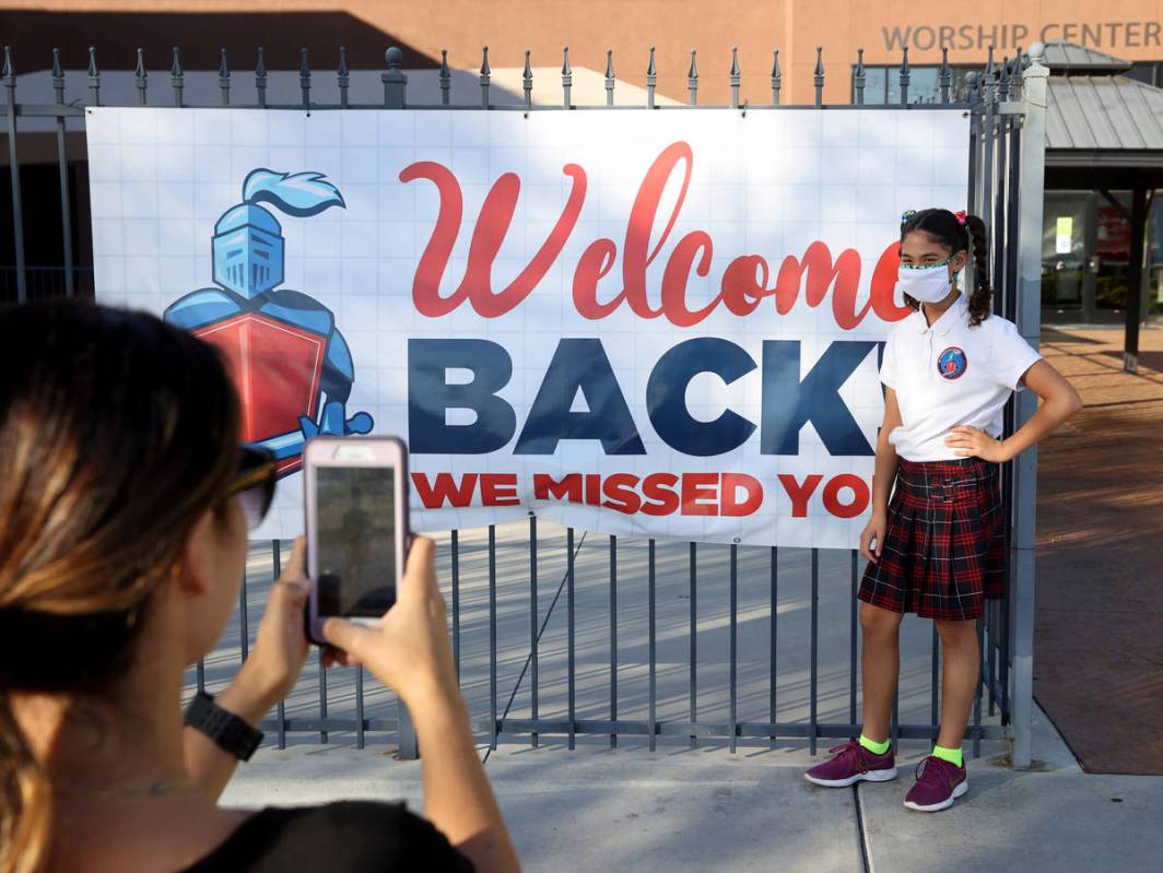 Zarah Ghadban gets her photo taken by her mother Mariam on the first day of school at Green Val ...