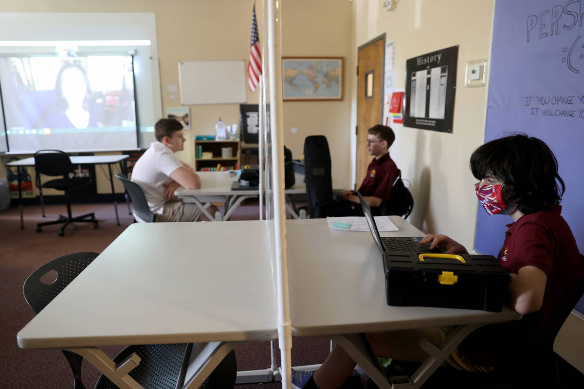 Tenth grader Jacob Braunstein listens to English literaturer teacher Sandy McCluney the first d ...