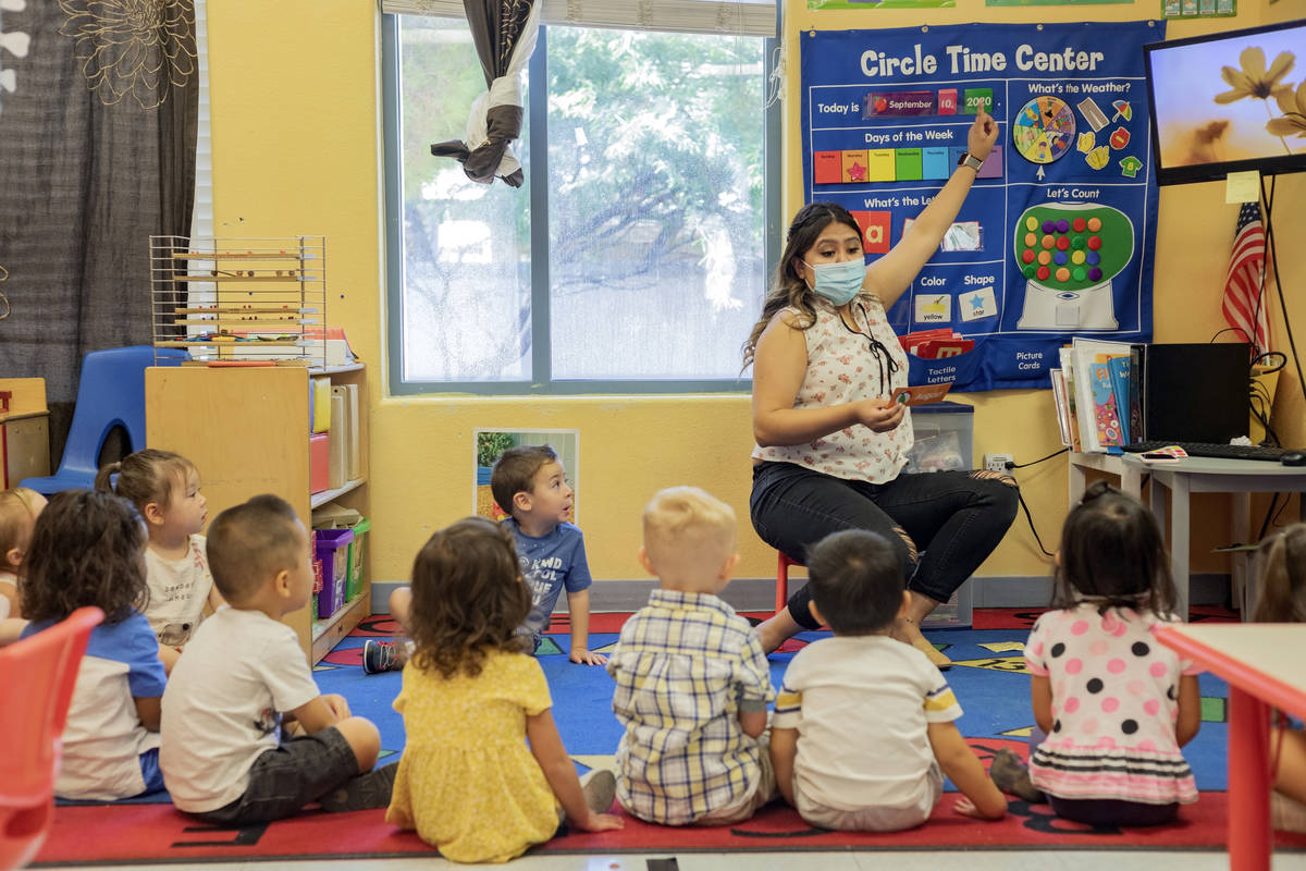 Lead Teacher for the 2’s classroom, teaches goes over the days of the week during the fi ...