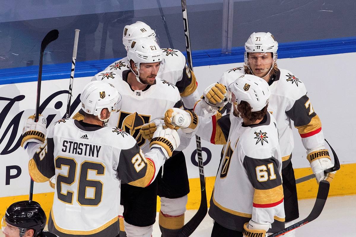 Vegas Golden Knights celebrate a goal during the second period of an NHL hockey playoff game ag ...