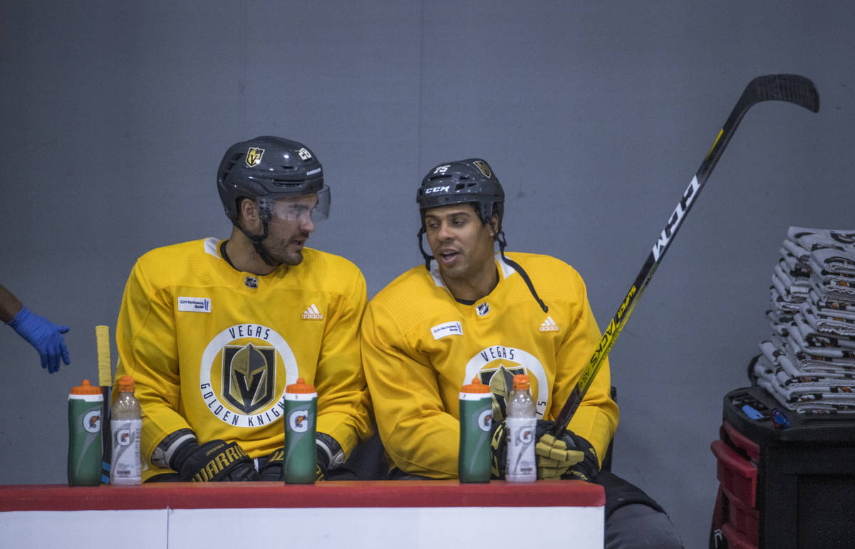 Vegas Golden Knights left wing William Carrier (28, left) and right wing Ryan Reaves (75) talk ...