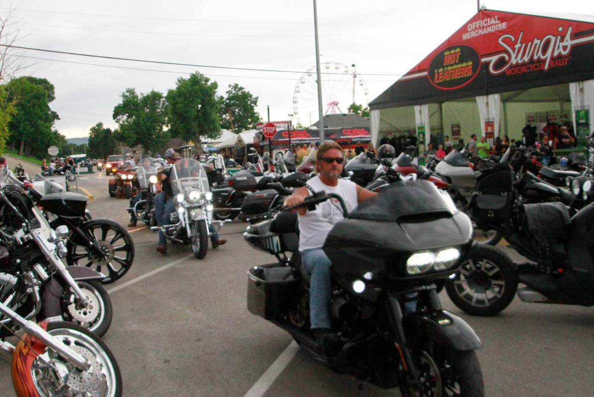 Bikers ride through downtown Sturgis, S.D., on Friday, Aug. 7, 2020. Organizers of the Sturgis ...
