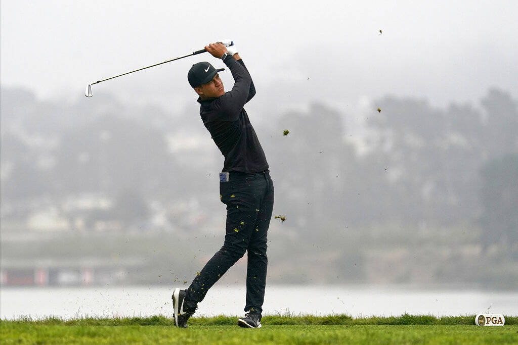 Cameron Champ watches his tee shot on the 15th hole during the third round of the PGA Champions ...