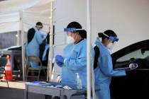 UNLV Medicine certified medical assistants test curbside for COVID-19 at the school in Las Vega ...