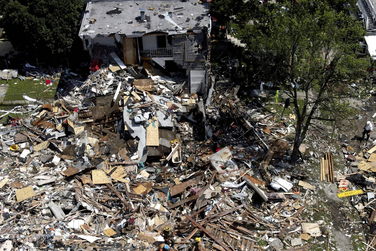 Debris and rubble covers the ground in the aftermath of an explosion in Baltimore on Monday, Au ...