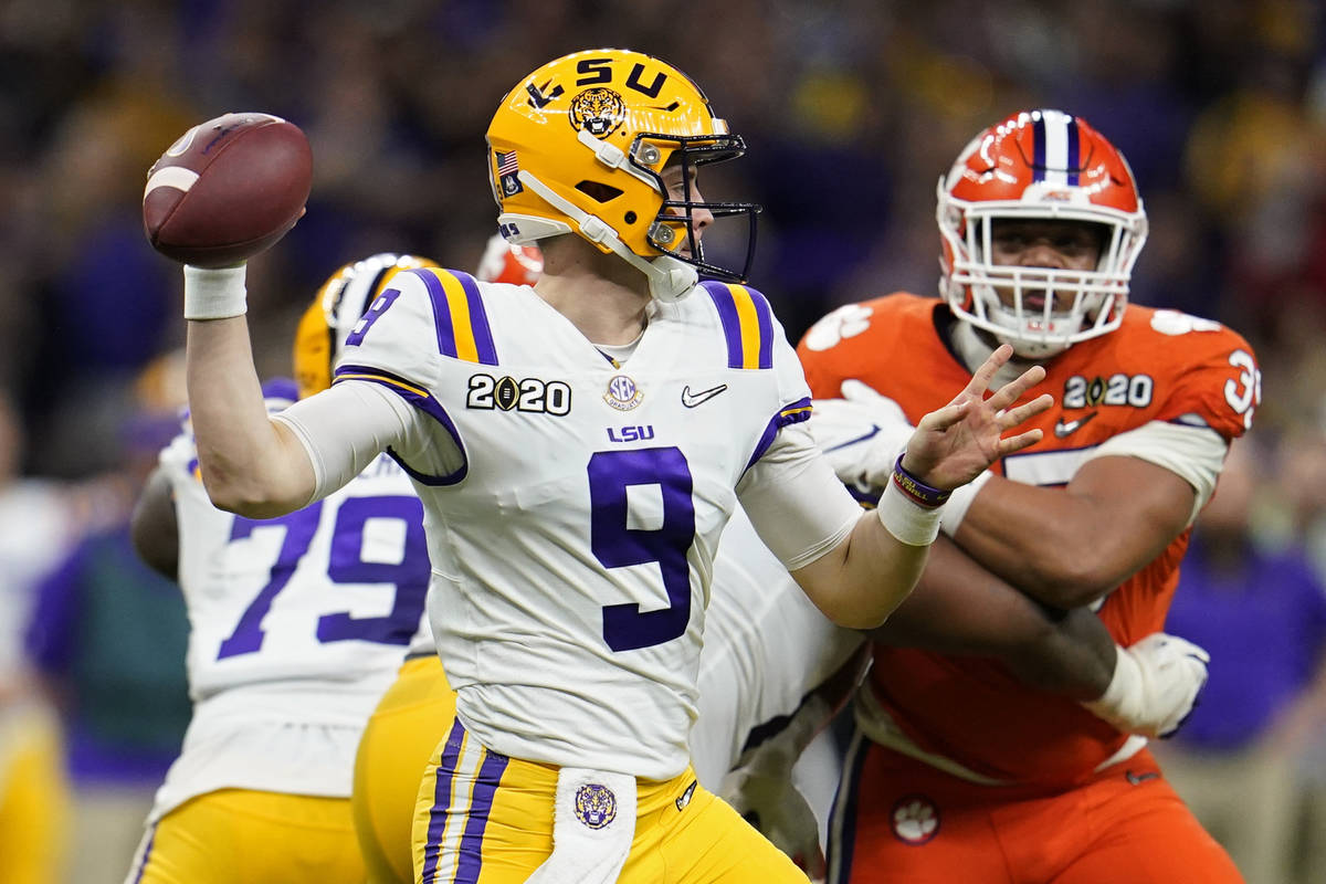 LSU quarterback Joe Burrow passes against Clemson during the first half of a NCAA College Footb ...