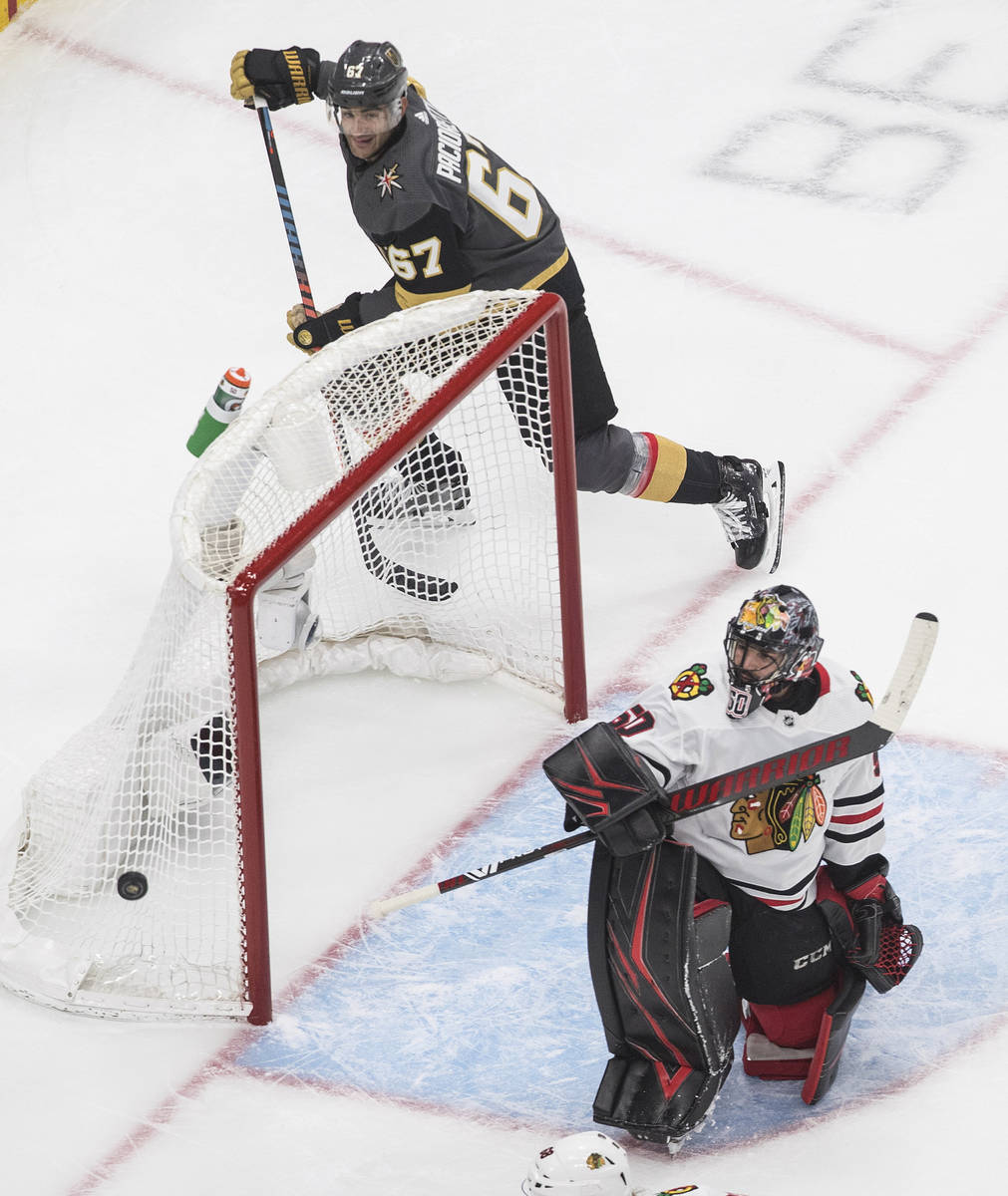 Chicago Blackhawks goalie Corey Crawford (50) looks for the puck on a shot from Vegas Golden Kn ...