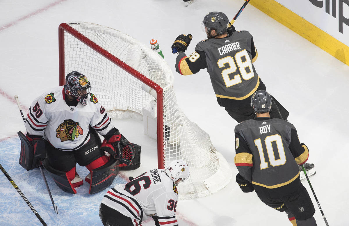 Chicago Blackhawks goalie Corey Crawford (50) looks back after a goaly by Vegas Golden Knights' ...