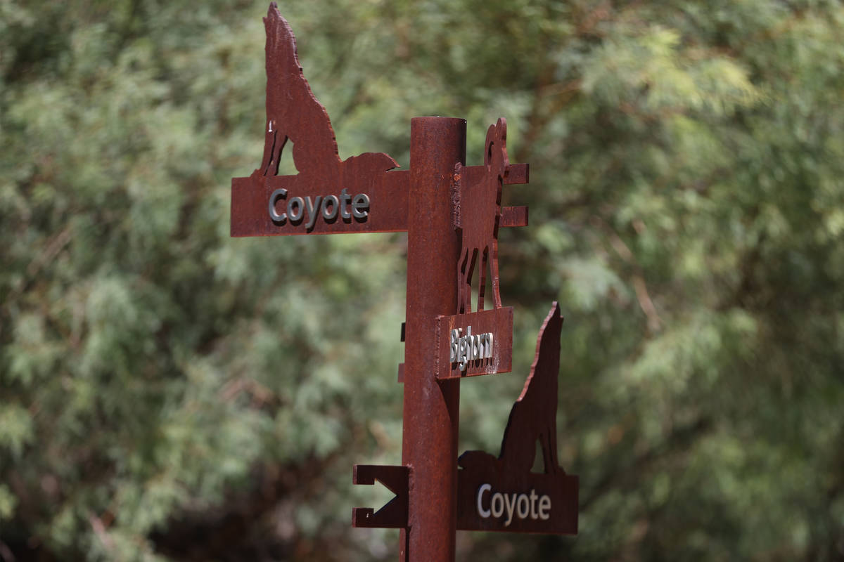 Trail signs at the Desert National Wildlife Refuge in Las Vegas, Wednesday, Aug. 12, 2020. (Eri ...