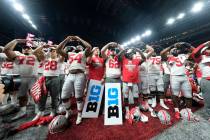 FILE - In this Dec. 8, 2019, file photo, Ohio State players celebrate the team's 34-21 win over ...