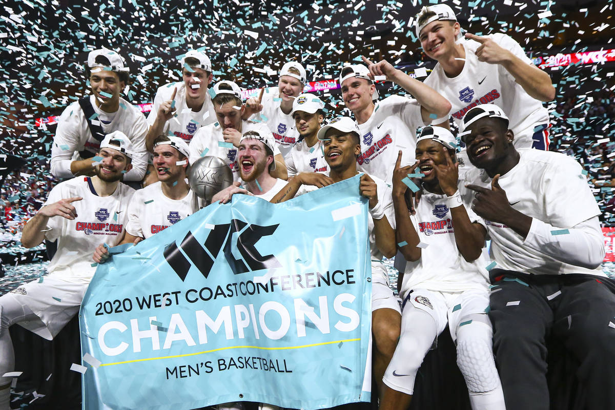 Gonzaga players celebrate after defeating St. Mary's to win the West Coast Conference tournamen ...