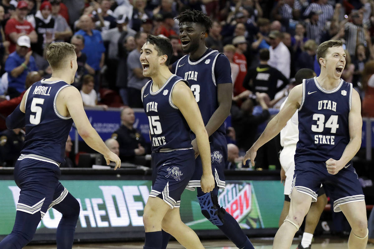 Utah State reacts after Sam Merrill (5) sunk a 3-point basket with seconds remaining in the sec ...