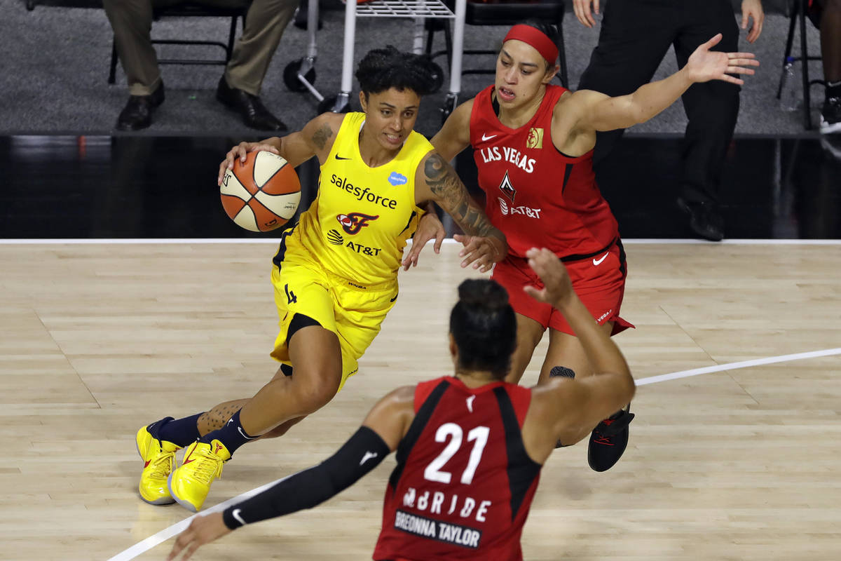 Indiana Fever forward Candice Dupree (4) drives against Las Vegas Aces forward Dearica Hamby (5 ...