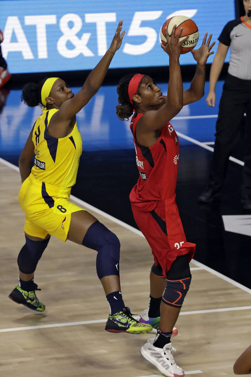 Las Vegas Aces forward Angel McCoughtry (35) shoots in front of Indiana Fever forward Kennedy B ...
