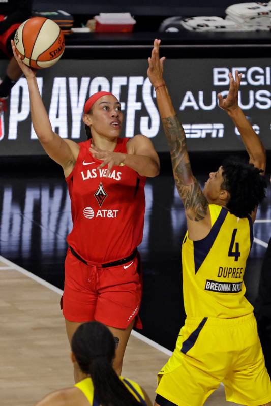 Las Vegas Aces forward Dearica Hamby (5) shoots over Indiana Fever forward Candice Dupree (4) d ...