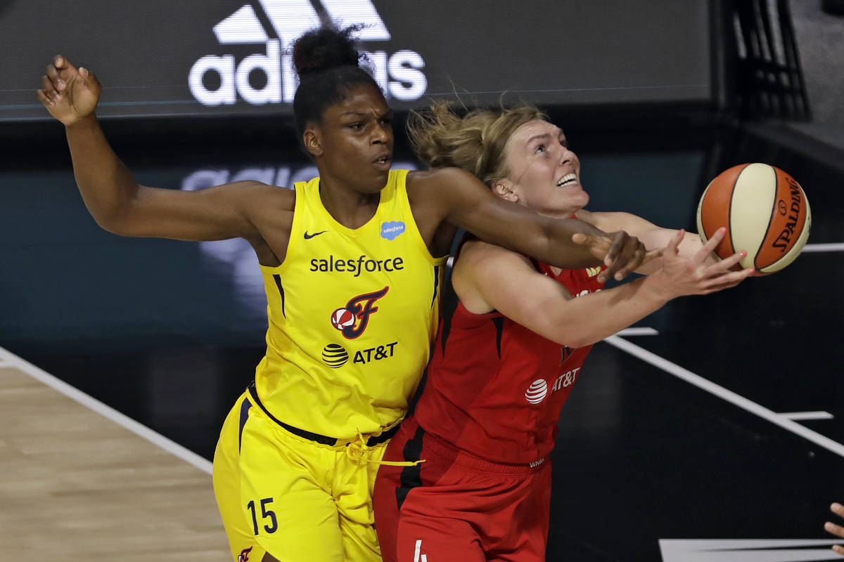 Indiana Fever center Teaira McCowan (15) fouls Las Vegas Aces center Carolyn Swords (4) during ...