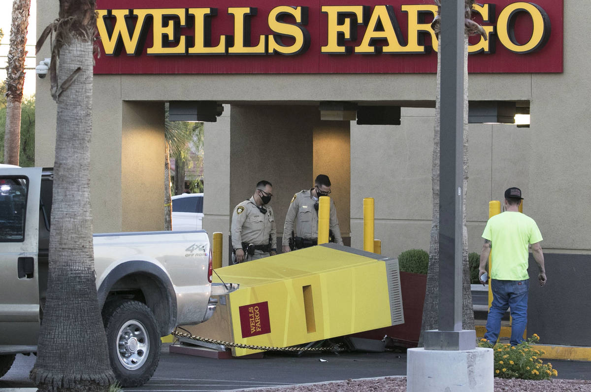 The Metropolitan Police Department investigates an apparent failed attempt to drag an ATM off i ...