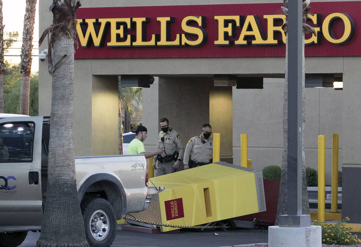 The Metropolitan Police Department investigates an apparent failed attempt to drag an ATM off i ...