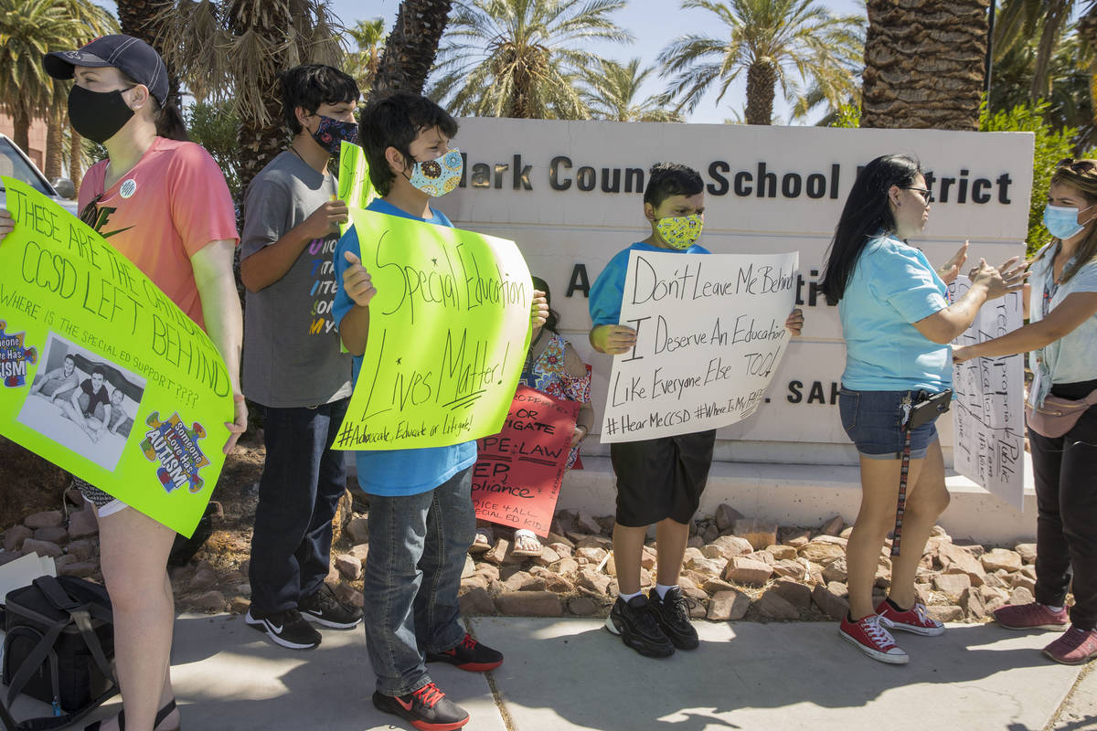 Clark County School District parents and students stand outside the administration center to pr ...