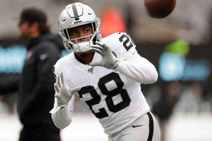 Oakland Raiders running back Josh Jacobs (28) warms up before an NFL football game against the ...