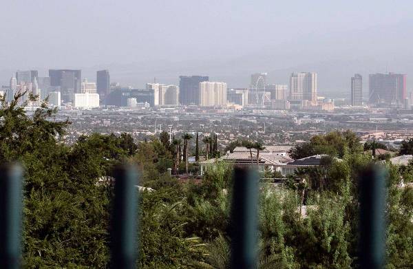 A haze hangs over the Strip as seen from Henderson on Thursday, Aug. 13, 2020, in Las Vegas. Cl ...