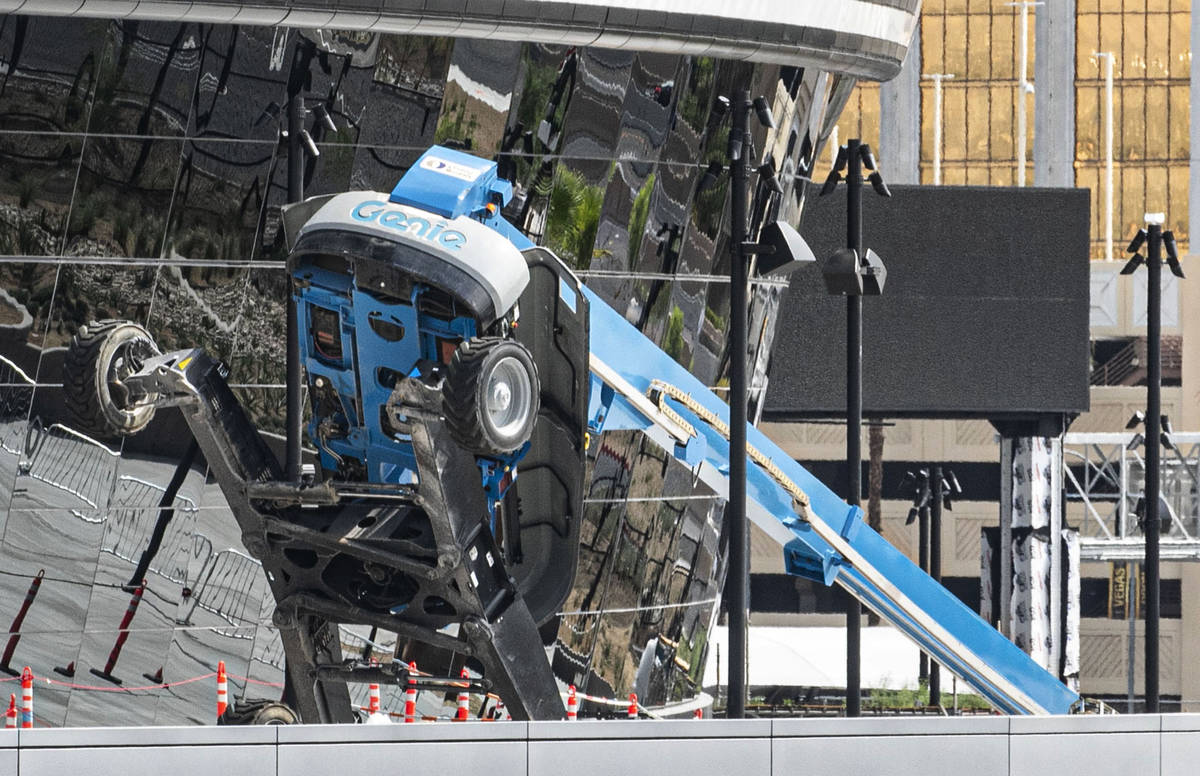 A boom lift lays on its side on the exterior of Allegiant Stadium in Las Vegas on Thursday, Aug ...
